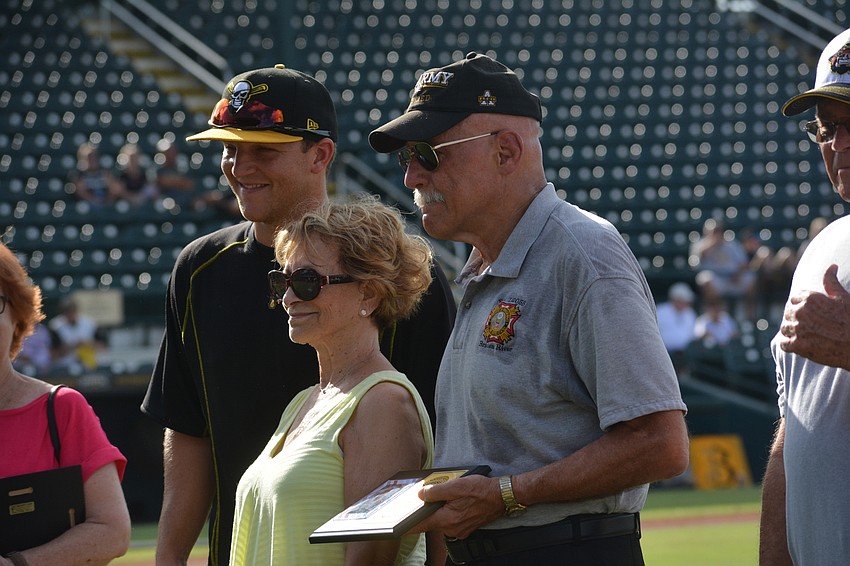East County's Gill Ruderman (right), a retired Army colonel, and his wife, Florence, enjoy the ceremony along with Marauders catcher John Bormann.