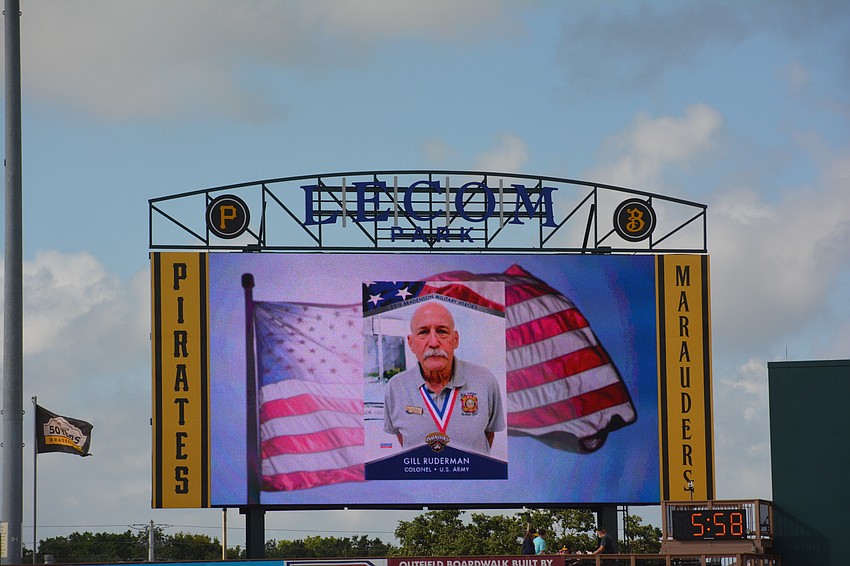 East County's Gill Ruderman sees his card flashed on the video display board at LECOM Park.
