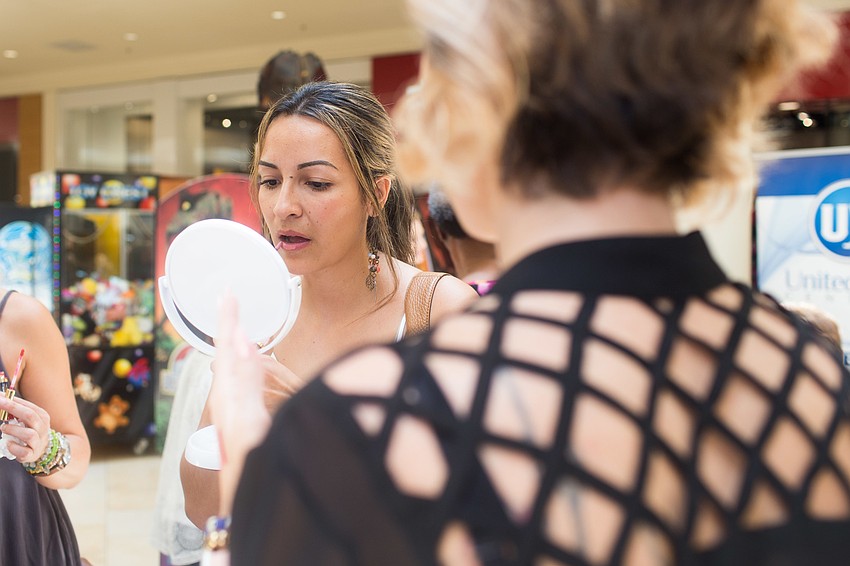 Marcela Alberti puts on Lipsense.