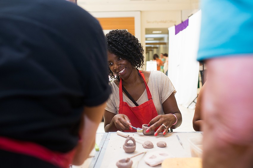 Shimeka Miller mades a piece of pottery.