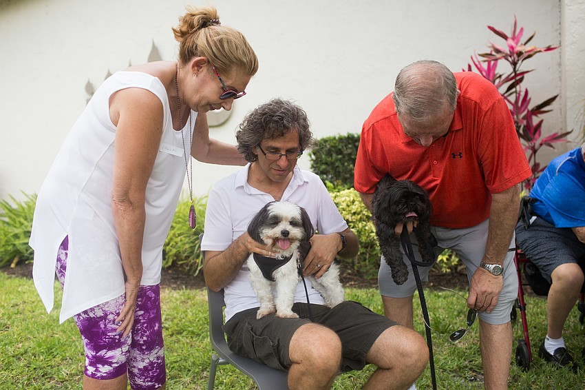 Helene Davis and Robert Griesman brought their dogs Mia and MJ to be blessed by Rabbi Brenner Glickman.