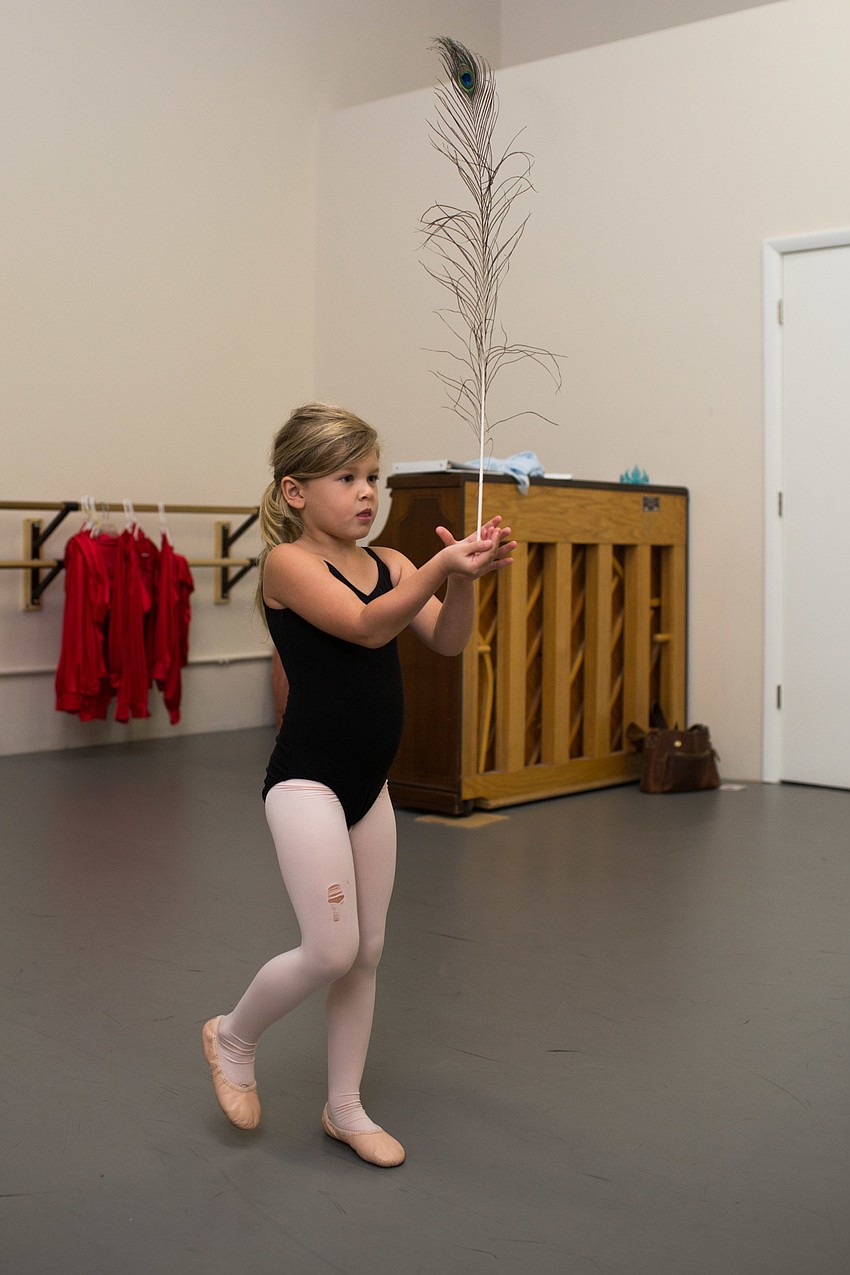 Emma Lynch walks with her feather.