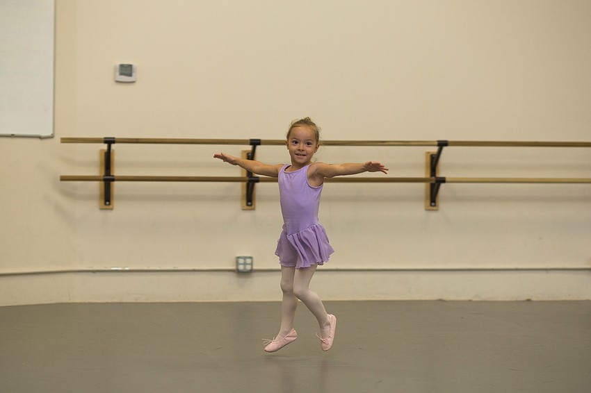 Gaines Turnbull pretends to be a cheetah as she dances.