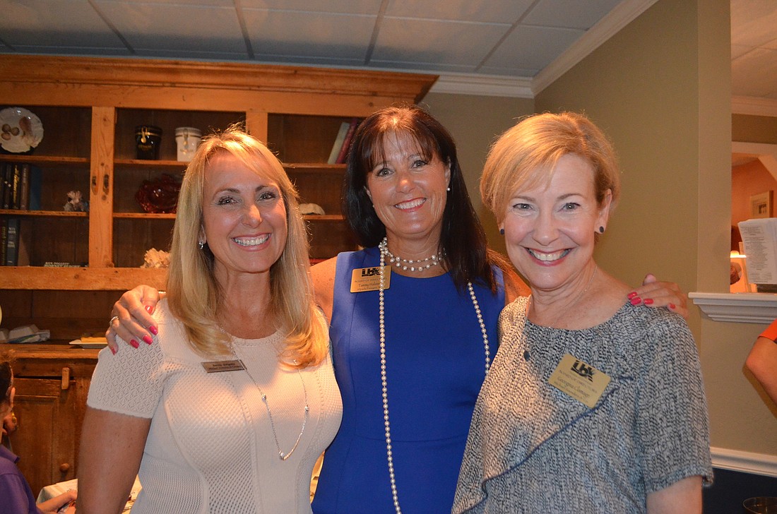 Becky Sirigotis of Michael Saunders and Co., Chamber Board Chairman Tammy Halstead and Georgina Clamage of Michael Saunders and Co. at August&#39;    s Networking at Noon.