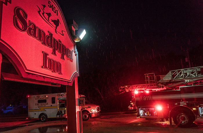 A fire tore through storage sheds at the gulf front property Sunday night, causing two propane tanks to explode.