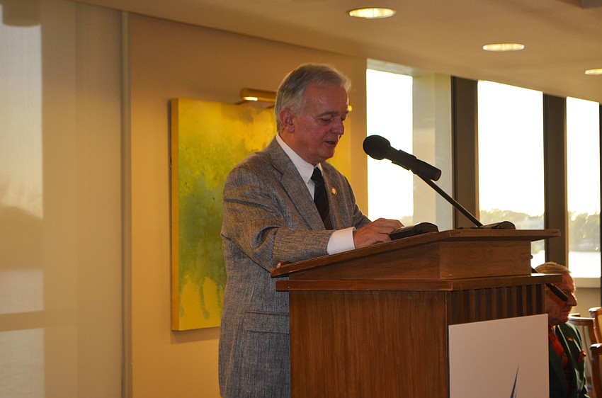 President and CEO of Plymouth Harbor Harry Hobson greets the crowd at the ribbon cutting for Plymouth Harbor’s renovated Pilgrim Hall on Dec. 22.