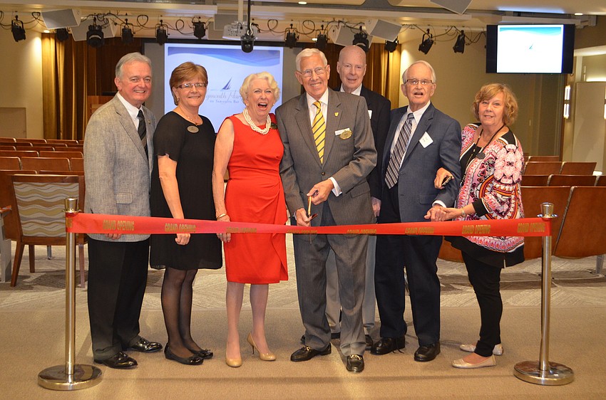The project design team for the Pilgrim Hall renovation stands at one of the entrances to the new theater.