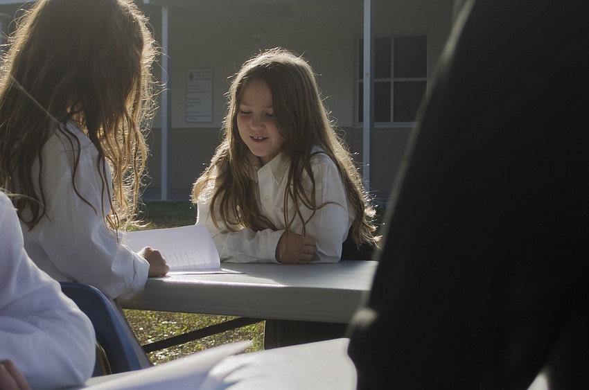 Sadie Pappas completes her medical examination at Phillippi Shores Elementary School’s mock Ellis Island.