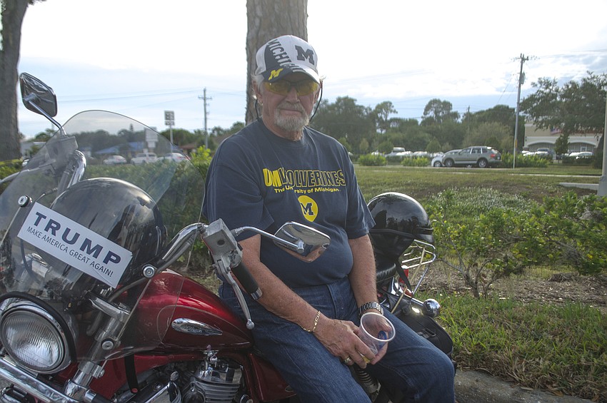 Bill Loader sits on his motorcycle outside The Coral House during the Welcome Thunder event.