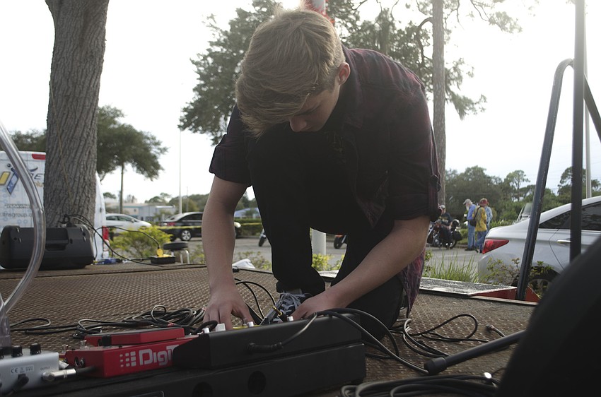 Lead guitarist Reed Spahn prepares for Steel Relic'     s performance.