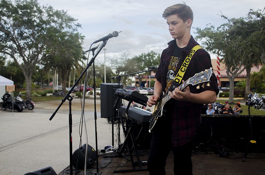 Reed Spahn plays his guitar during Steel Relic'     s sound check.