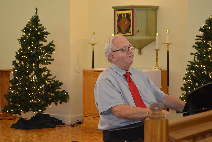 Dale Hooey plays the piano during the church’s Epiphany concert. Although the concert is an annual event, the songs and performances change each year.