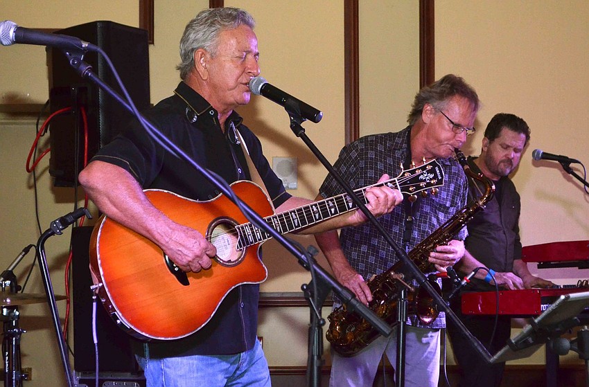 Members of The Billy Rice Band perform for the crowd.