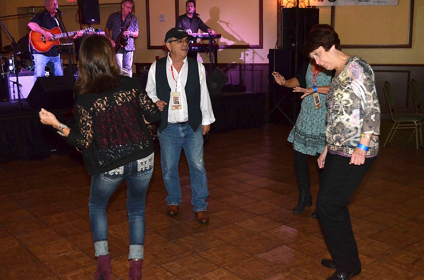 Attendees dance along to the beat of The Billy Rice Band.