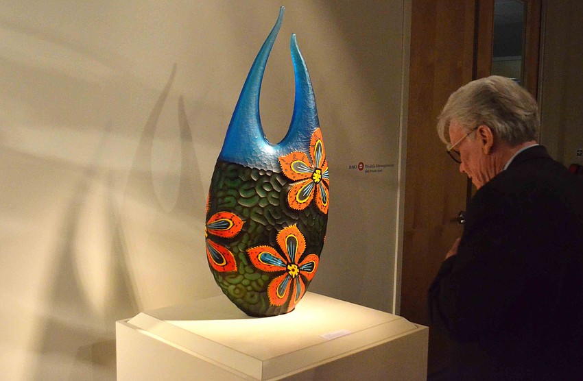 John Hicks admires “Florito,” 2016 by Davide Salvadore.