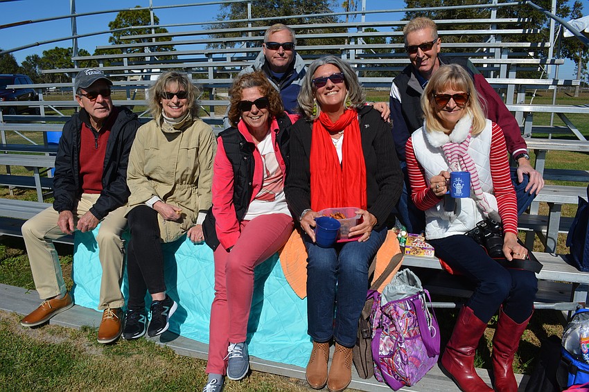 Phil and Chris Zimmerman, of Venice; Karen and Ross (behind) Versaggi, of Punta Gorda; Kathleen Popper, of Treasure Island; and George (behind) and Leesa Carlin, of Sarasota, brought hot chocolate to sip while watching the match.
