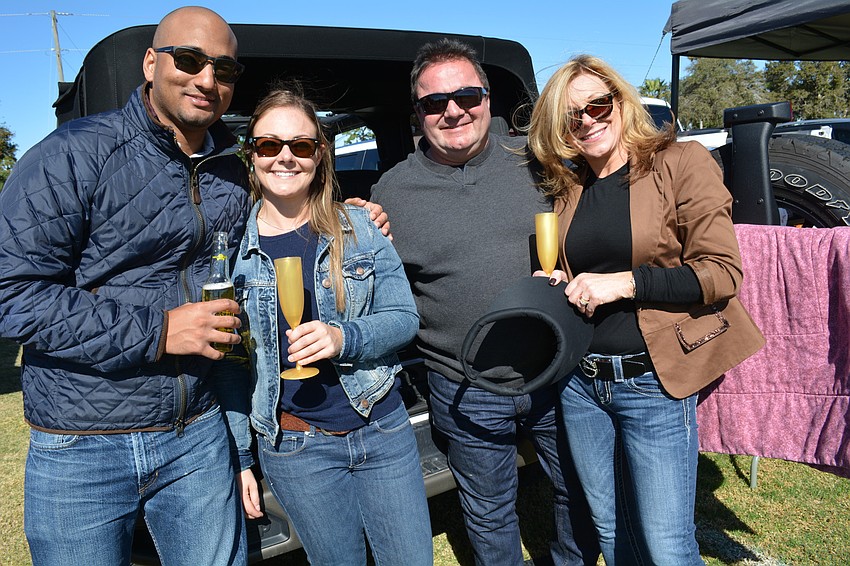 Michael Hutchinson and Kaitlyn Swarts drink beer and Champagne while visiting Doug and Debbie Swartz, of The Meadows, from Canada.