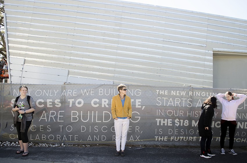 Mariah Moses, Amy Pettengill, Sabine Kwan and Stephanie Schneider line up along Martin Luther King Jr. Way before the ceremonial passing of the books.
