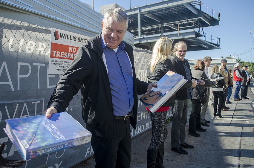 Dean of Admissions Jim Dean helps pass books from Kimbrough Library to  Alfred R. Goldstein Library.