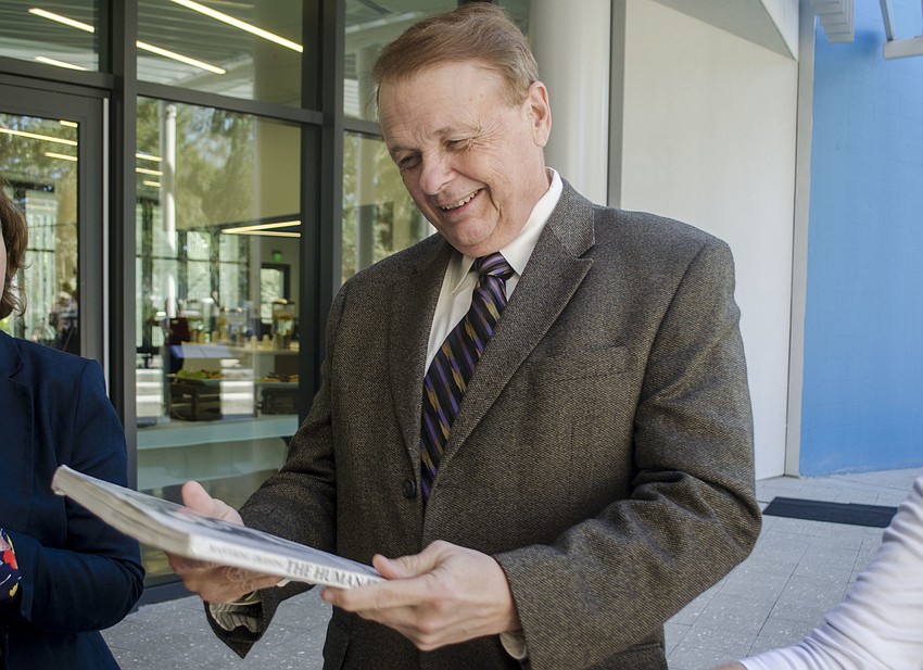 Larry Thompson stands near the end of the assembly line.