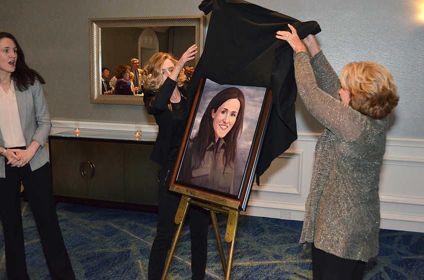 The portrait of Liz Murray is unveiled.