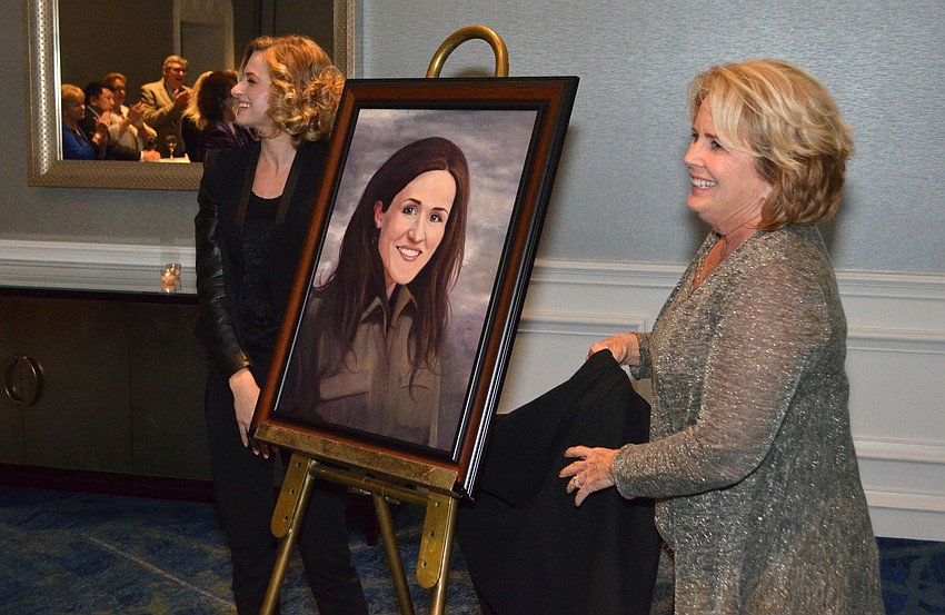 The portrait of Liz Murray is unveiled.