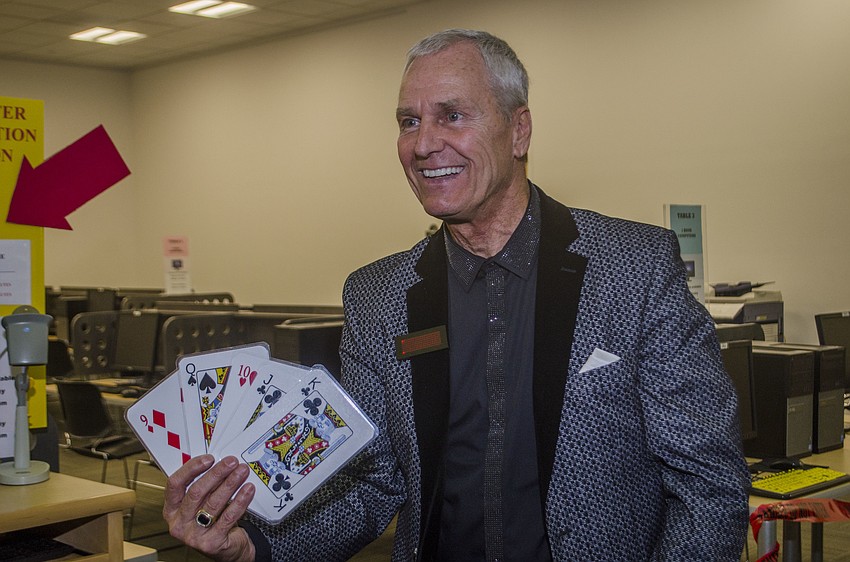 Gary Roberts performs and card trick.