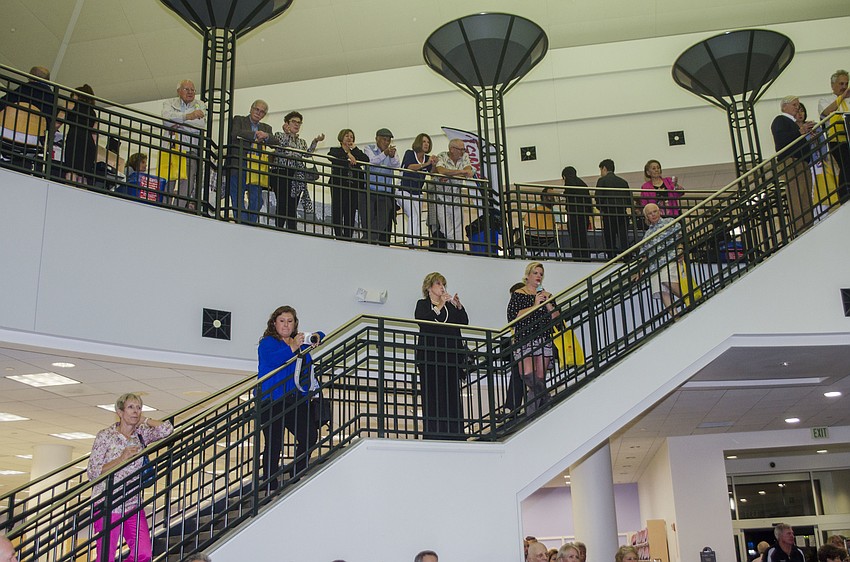 Attendees watch performances from the mezzanine.