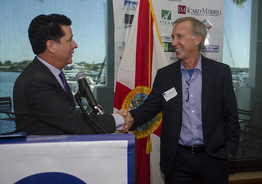 Incoming President Jeff Charlotte thanks outgoing President Rod Hershberger.