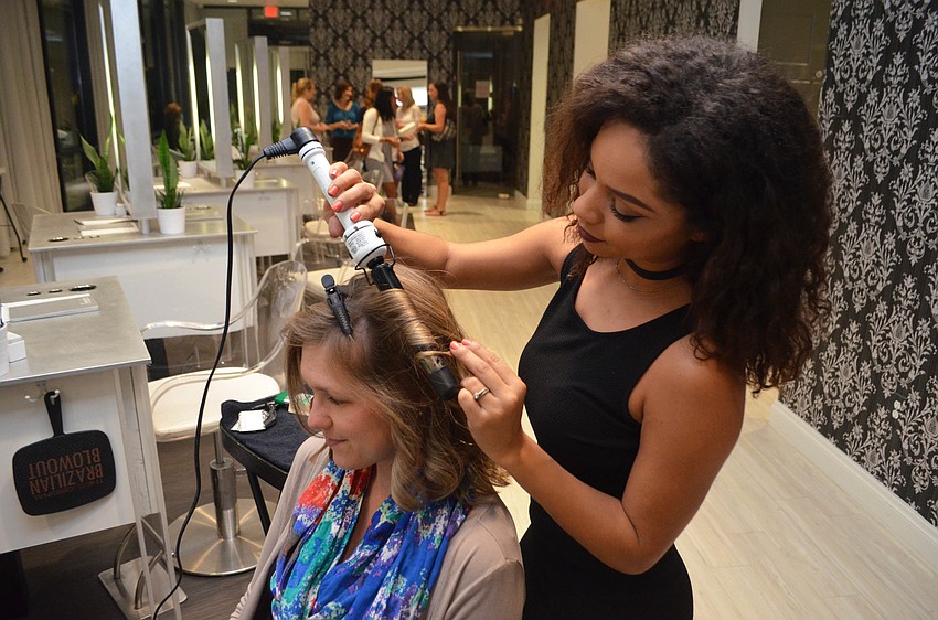 Emily Weitekamp gets a “beachy wave” hairdo by Fresh Salon & Spa stylist Asia Bebber.