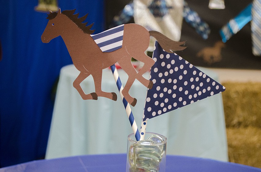 Tables were decorated with paper horses and flags.