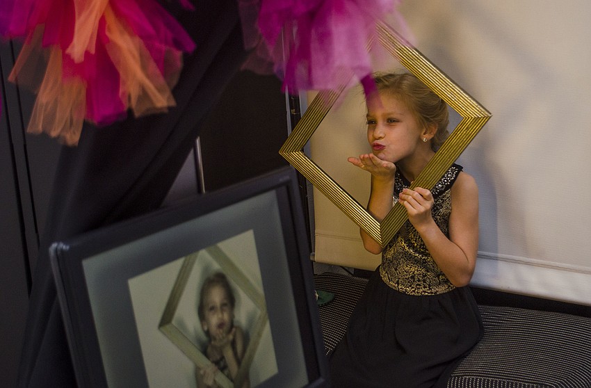 Hanna Hornung gets her photo taken in the photo booth.