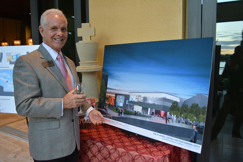 Players advisory committee member Lyn Wiley shows off a rendering of the new theater complex.