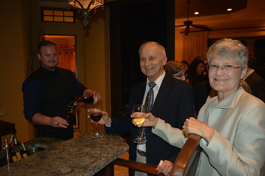 Bartender Connor Lane serves Lakewood Ranch'  s Blair and Joy McMillan.