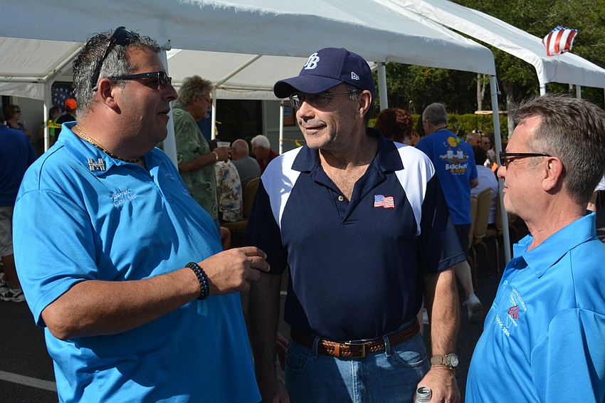 Elks Exalted Ruler Darrin Simone talks with new member Jim Williamson and current member John Piper at the open house.