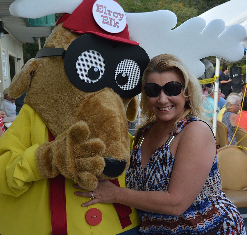 LeRoy Elk has fun with Chellie Buechler who had just applied for her Elks membership.