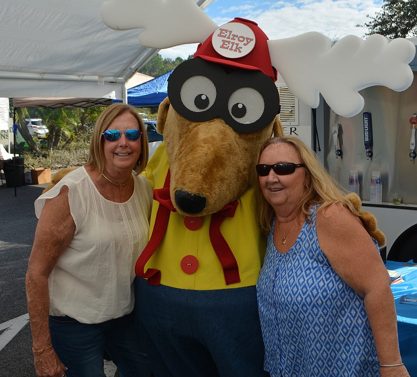 Sue Kersey and Kathi Beck have a little fun with LeRoy Elk at the open house.