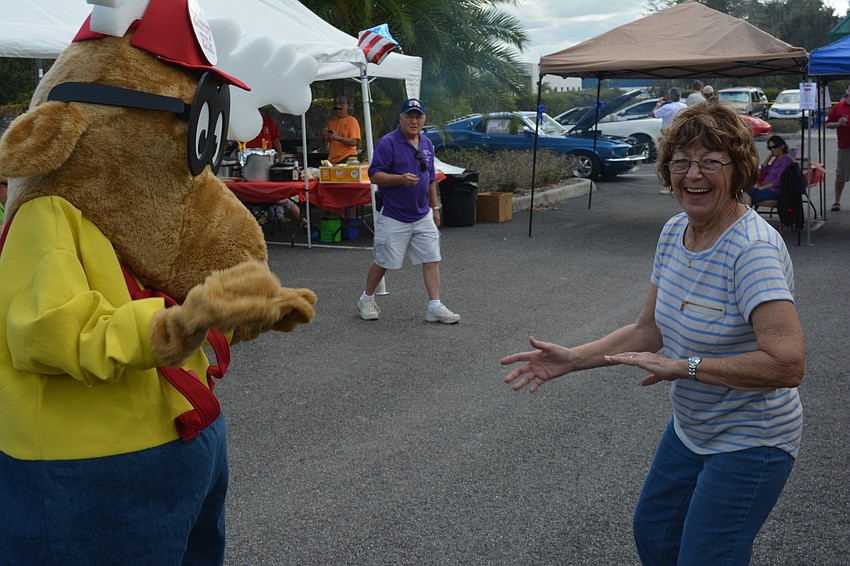 LeRoy Elk dances with Rena Orlando during the open house. Dawn Fallon handled duties as the mascot.