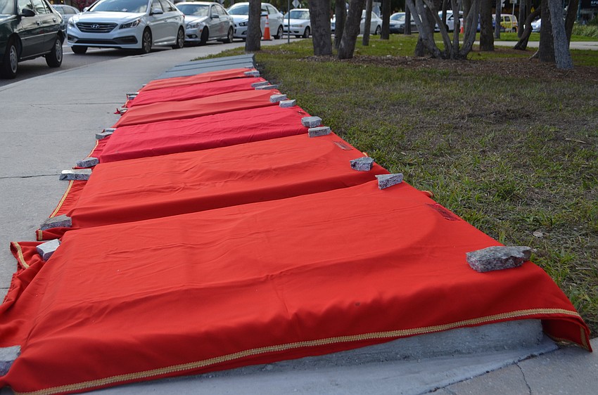 Red blankets covered each new wagon wheel plaque on the Circus Ring of Fame around St. Armands Circle.