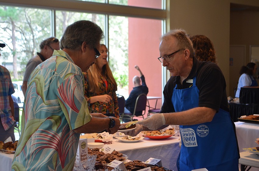 T.J. Miller was one of many volunteers who helped serve food during the 9th annual Jewish Food Festival.