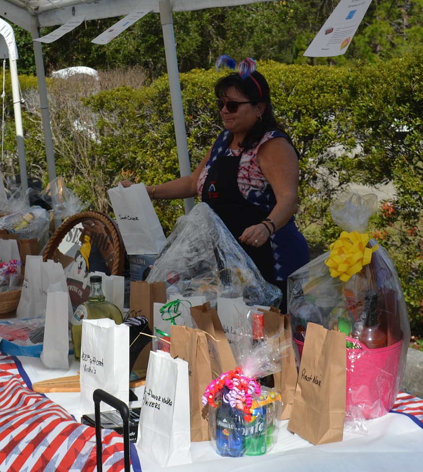 Donna Van Riper handles the raffle items during the open house.