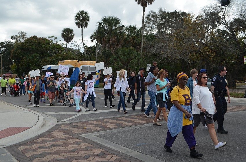 Participants march down Dr. Martin Luther King Way.