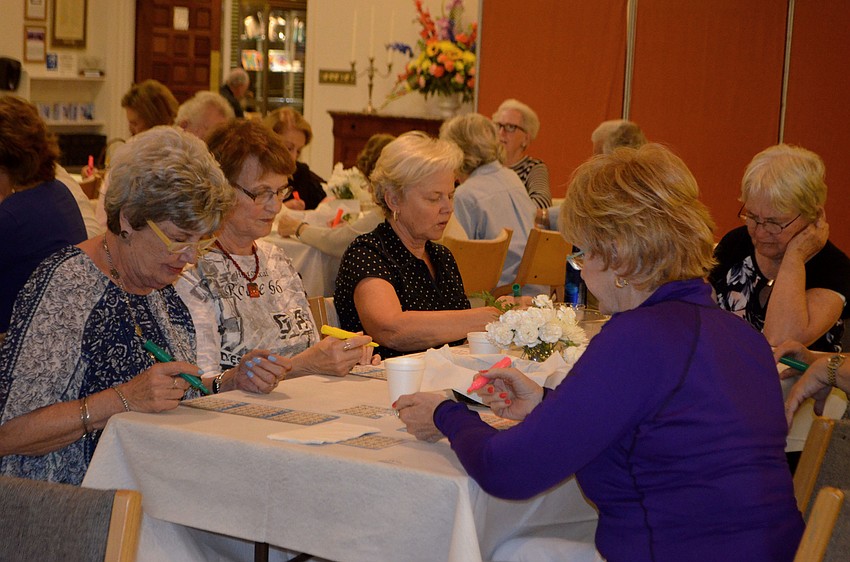 Attendees mark their cards as numbers are called during Temple Beth Israel’s bingo night on Jan. 16.