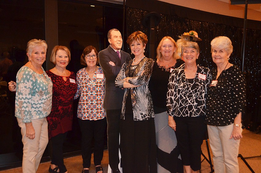 Planning committee members Kathy Neudorfer, Peggy Jelinek, Gloria Long, performer Marcy Downey, Susan Pariseau, Mary Del Pup and Pat Stusek pose with an Ed Sullivan cutout.