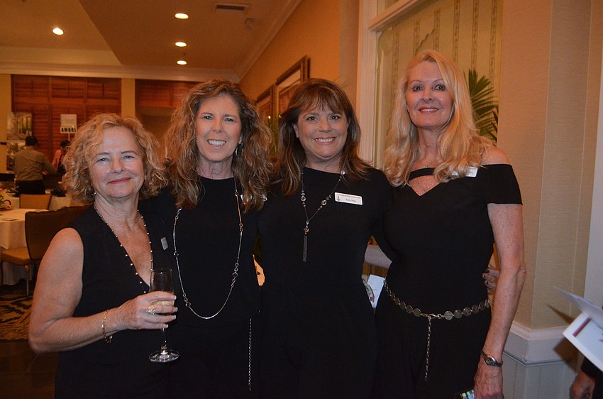 Committee members Palma Panza, Lyn Haycock and Patty Sileo enjoy the evening with Longboat Key Garden Club president Susan Phillips.