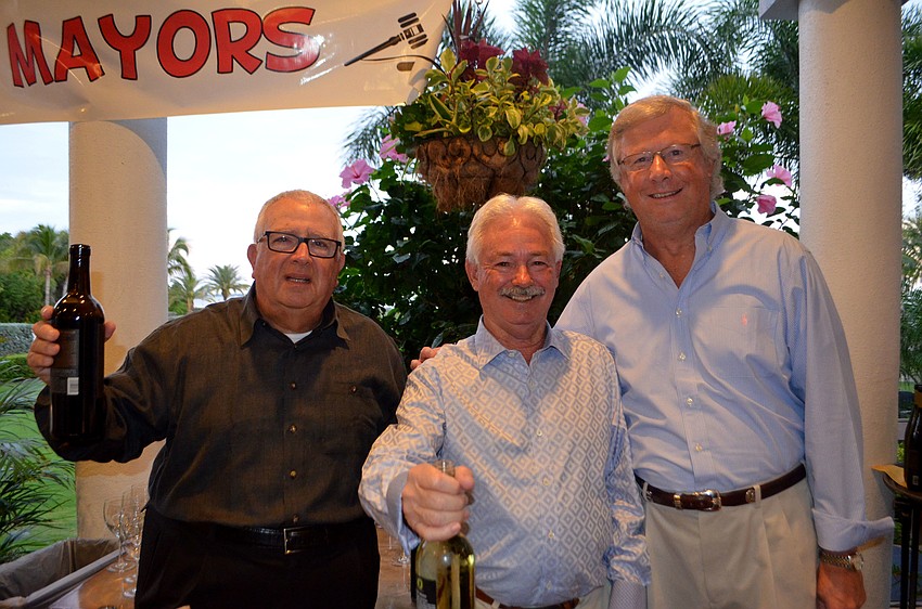 Celebrity bartenders Mayor Terry Gans, former Mayor Jim Brown and Gary Ulrich