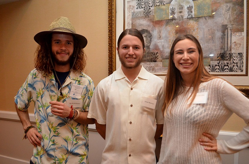 Fashion show models and previous garden club scholarship recipients Jay McWilliams, Orion Morton and Juliana Carrillo
