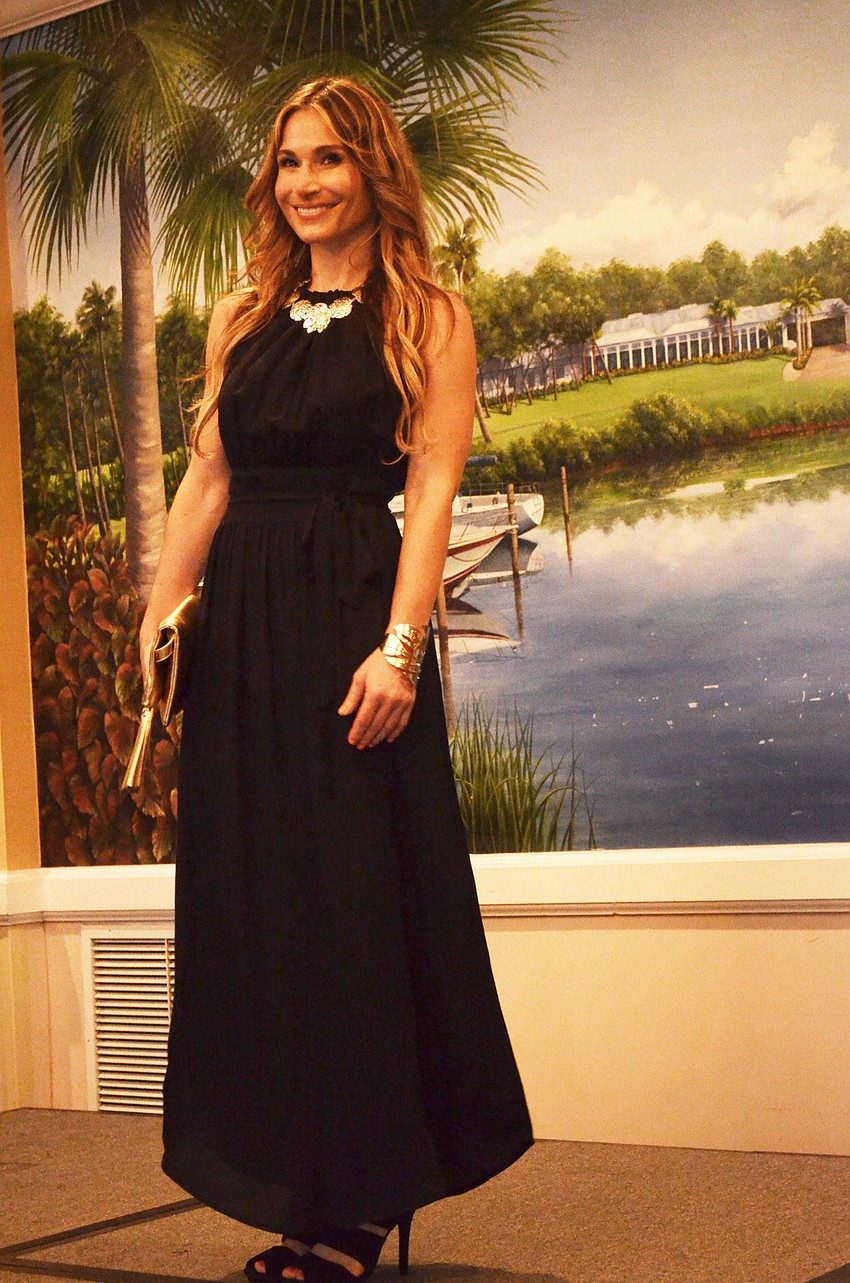 Tracy Fanara models a black dress from Tommy Bahama during the 6th annual Taste of the Keys and Fashion Show.