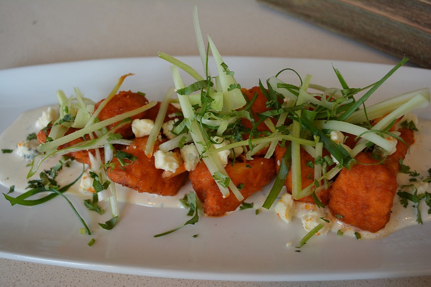 Spicy Buffalo cauliflower is just one of California Pizza Kitchen'  s non-pizza offerings. The restaurant opens in Sarasota on Monday.
