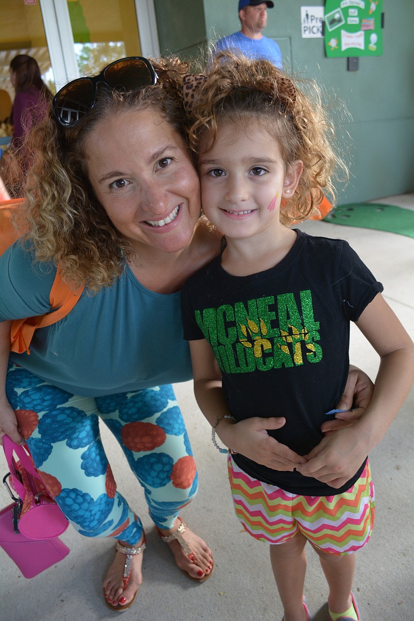 Six-year-old Skyla Campano, with her mom, Angela Campano, says she likes picking out prizes.